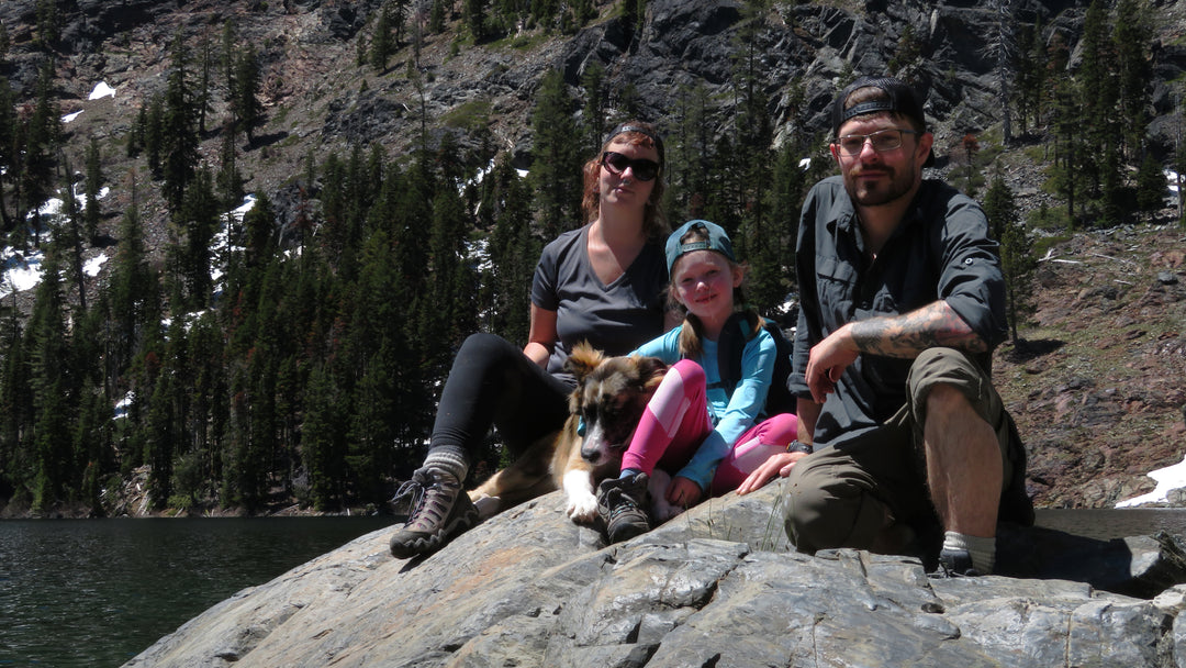 Brendan McCullough and his family sitting above a lake